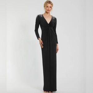 Mac Duggal Black Jersey V Neck Faux Knot Gown With Beaded Shoulders.